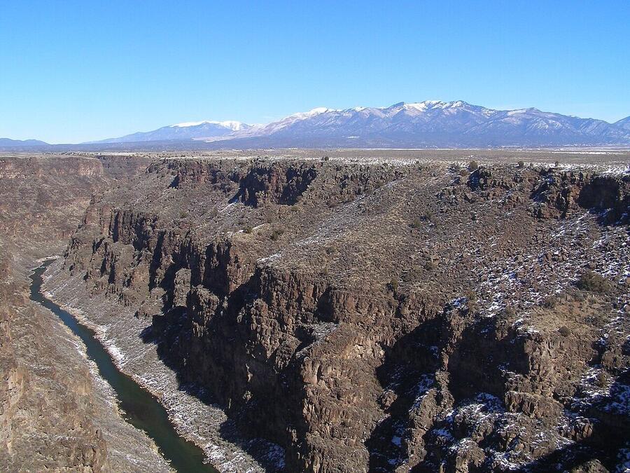The Rio Grande Gorge with the snow-capped Sangre de Cristo Mountains beyond